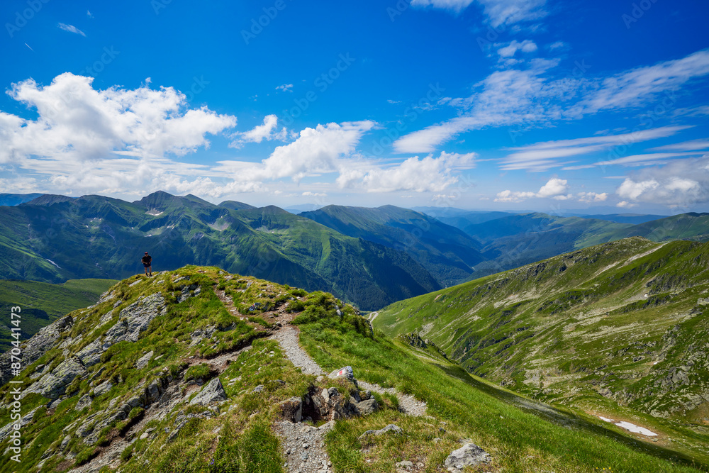 A middle-aged man walking on the mountain A middle-aged man walking on the mountain