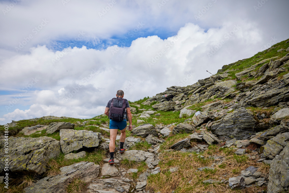 A middle-aged man walking on the mountain A middle-aged man walking on the mountain