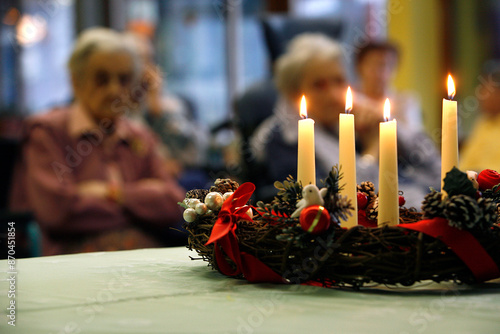 Advent wreath. Christmas mass in a retirement home. France.