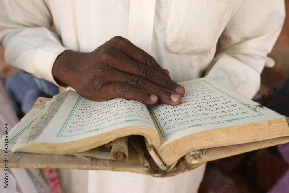 Fototapeta premium African man reading the Quran. Mali.