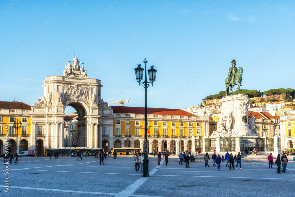 Fototapeta premium Commerce Square or Praça do Comércio with statue of Dom José I, King on horse is symbolically crushing snakes on his path.
