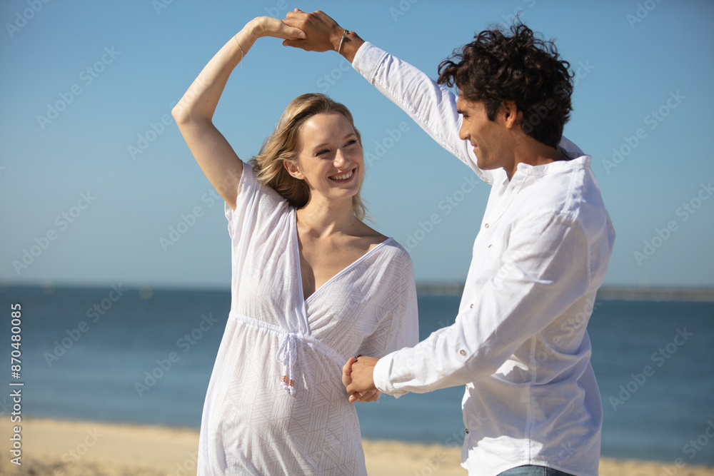 happy couple dancing at beach happy couple dancing at beach