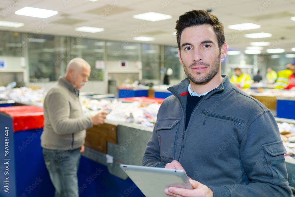 Fototapeta premium portrait of male worker in recycling plant