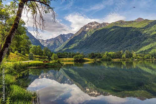 Water reflection in Lac de Génos-Loudenvielle in Vallée de Louron (Louron Valley), Hautes-Pyrénées, France photo