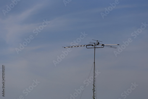 Antique television antenna set outdoors.