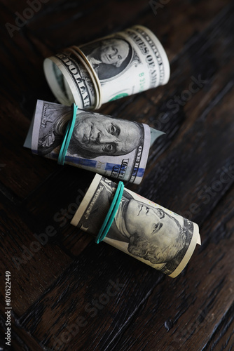 Money, US dollar bills background. Money scattered on the desk. Photography for Finance and Economy concepts. photo