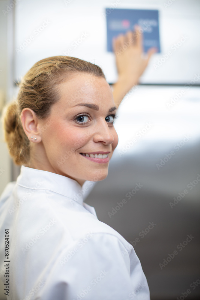 pastry chef smiling at the camera pastry chef smiling at the camera
