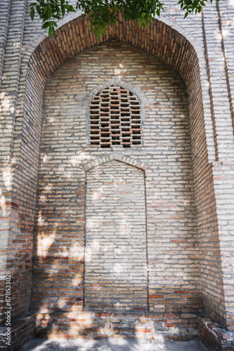 ancient door is bricked up on wall of the old medieval Barakhan madrasah in Hazrati Imam complex in Tashkent photo