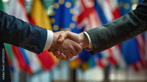 Handshake of presidents against the background of flags of the European Union