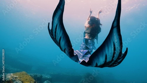 professional freediving mermaid girl no mask dancing in blue water showing beautiful mermaid costume fishtail Asia Taiwan 