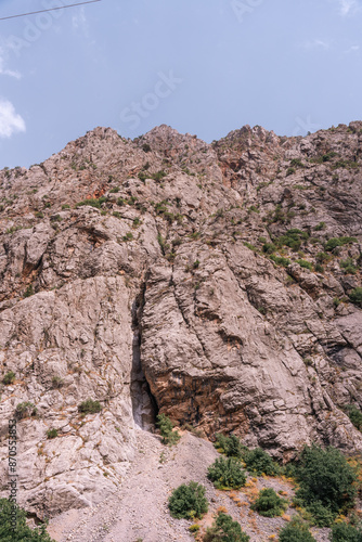 A mountain with a large hole in it