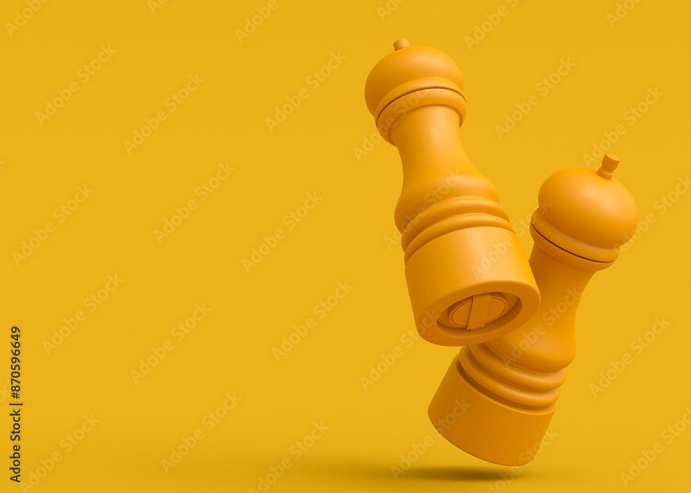 Set of salt or pepper wooden mill filled with peppercorns on monochrome yellow Set of salt or pepper wooden mill filled with peppercorns on monochrome yellow