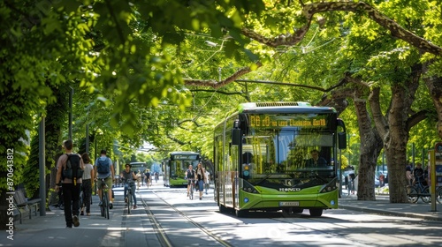 Obraz na płótnie A green boulevard with electric buses, bike lanes, and pedestrians strolling under a canopy of trees. w salonie