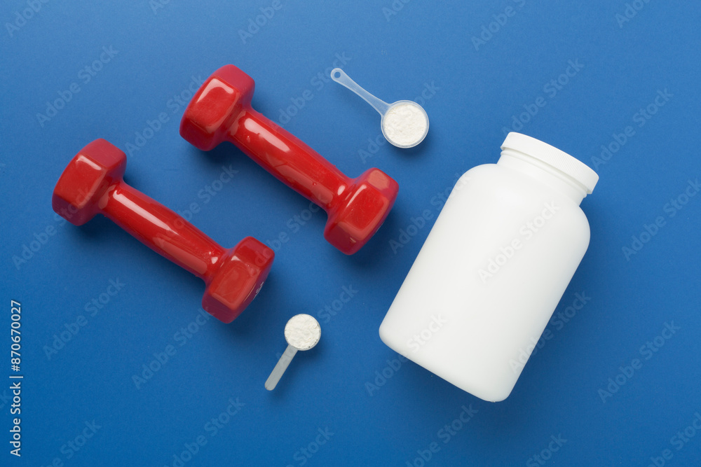 Jars with protein powder on color background, top view. Sports nutrition concept Jars with protein powder on color background, top view. Sports nutrition concept