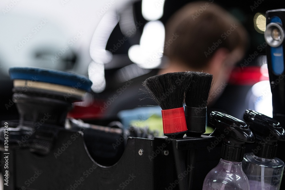 Tools and accessories used in car detailing electric polisher, brushes for cleaning hard to reach areas.