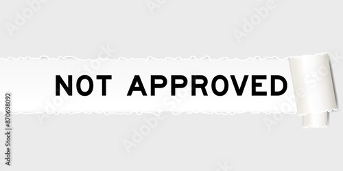 Ripped gray paper background that have word not approved under torn part