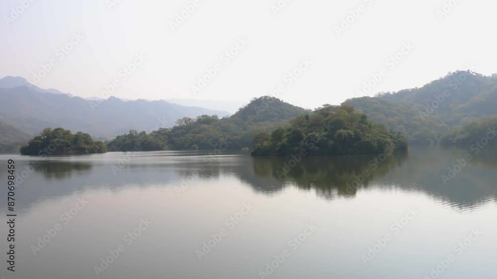 misty mountain landscape with pristine lake at day from flat angle misty mountain landscape with pristine lake at day from flat angle
