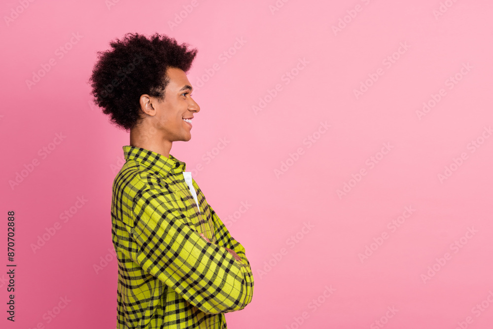 Photo of nice young man crossed arms empty space wear shirt isolated on pink color background Photo of nice young man crossed arms empty space wear shirt isolated on pink color background