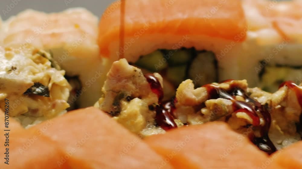 Sushi serving. Rolls set. Traditional asian food spice soy sauce pouring delicious meal delicacy in exquisite japanese restaurant. Sushi serving. Rolls set. Traditional asian food spice soy sauce pouring delicious meal delicacy in exquisite japanese restaurant.