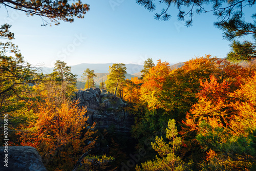 Fantastic view of cliffs surrounded by autumn forest. Dovbush Rocks, Carpathian mountains, Ukraine, Europe. photo