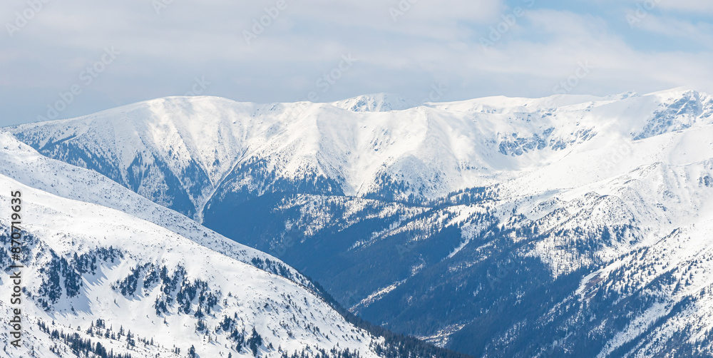 Fototapeta premium Winter mountain landscape in the Polish Tatra Mountains. View of the snow-capped peaks.