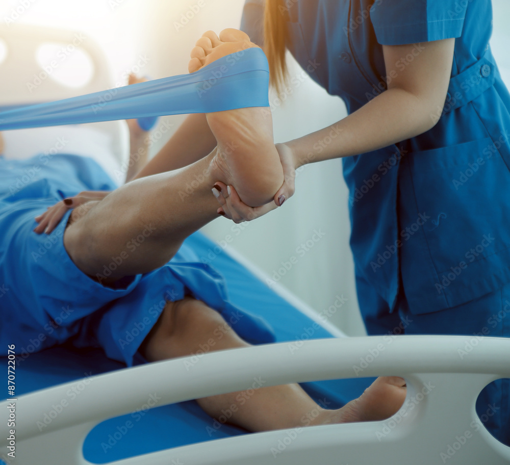 Physical therapists work with patients in close-up clinics. The concept of rehabilitation of physical health, the doctor gives advice to the patient. Ankle problems and muscle injuries