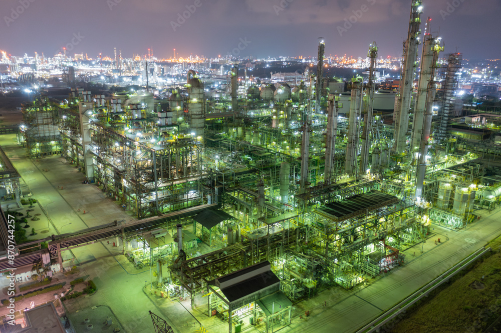 Fototapeta premium Nighttime Aerial View of Busy Refinery Complex