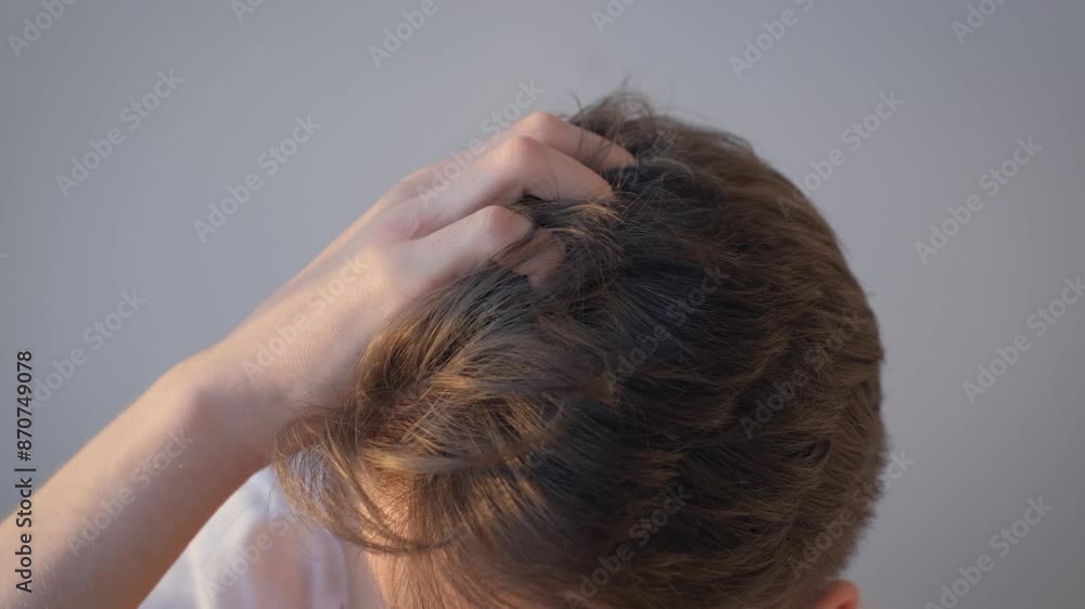 Man scratching his head with his hand over isolated background, close-up Man scratching his head with his hand over isolated background, close-up