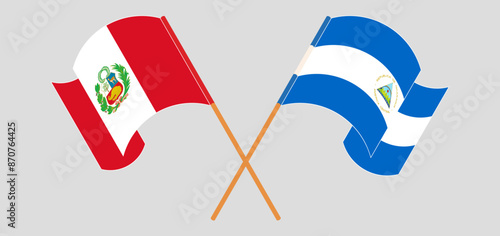 Crossed and waving flags of Peru and Nicaragua