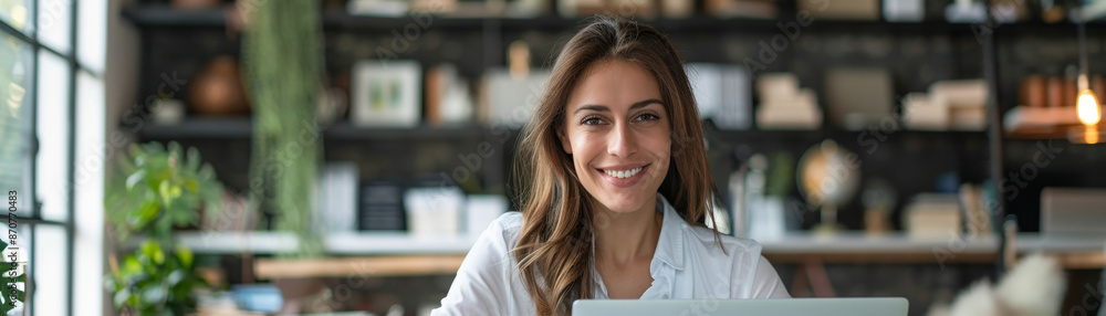 Happy professional woman using laptop in modern office, productivity and happiness concept. Happy professional woman using laptop in modern office, productivity and happiness concept.