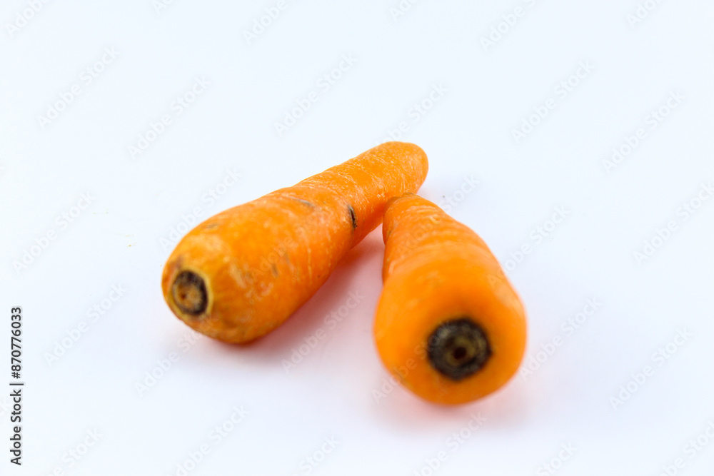two fresh orange carrots on a white isolated background two fresh orange carrots on a white isolated background