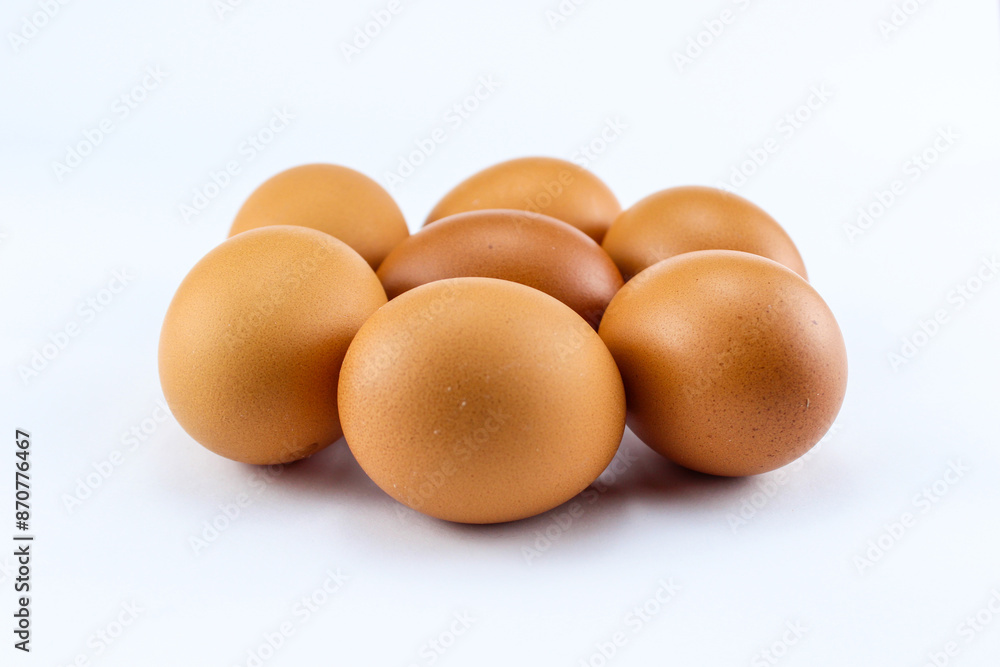 group of seven raw asian chicken eggs on white isolated background group of seven raw asian chicken eggs on white isolated background