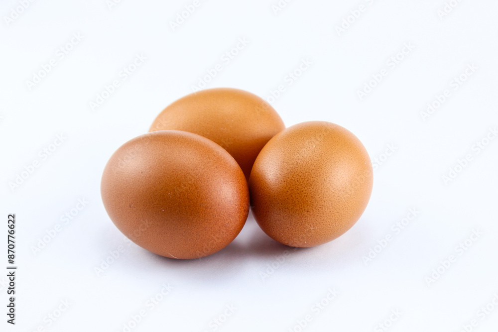 group of three raw asian chicken eggs on white isolated background group of three raw asian chicken eggs on white isolated background