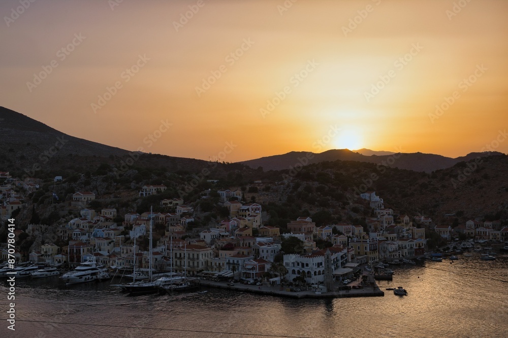 Fototapeta premium Beautiful sunset over Gialos bay, Symi island, Greece