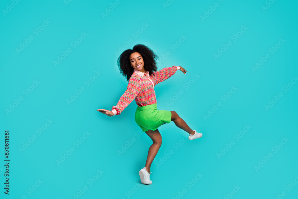 Obraz premium Full length photo of sweet pretty lady dressed print blouse dancing empty space isolated blue color background