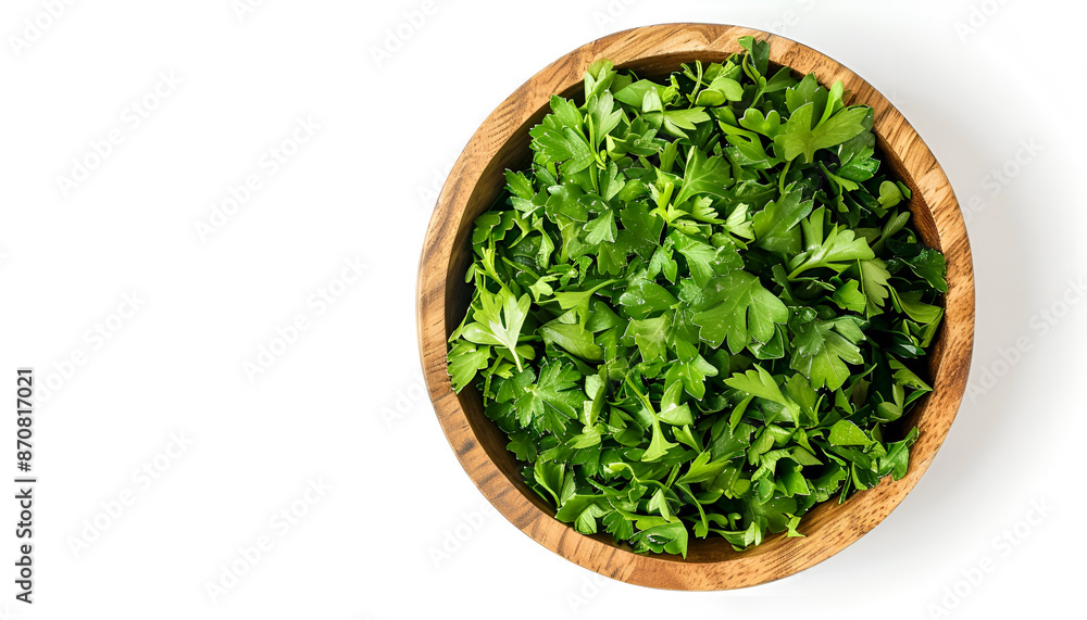 Chopped parsley leaves in wooden bowl isolated on white, top view Chopped parsley leaves in wooden bowl isolated on white, top view