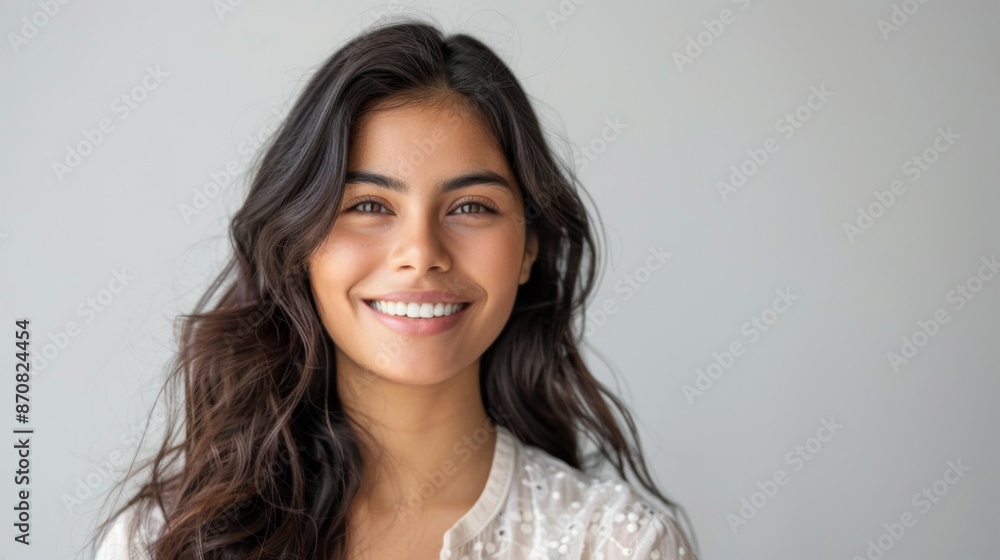 Portrait of a beautiful young latin model woman smiling on a white background Portrait of a beautiful young latin model woman smiling on a white background
