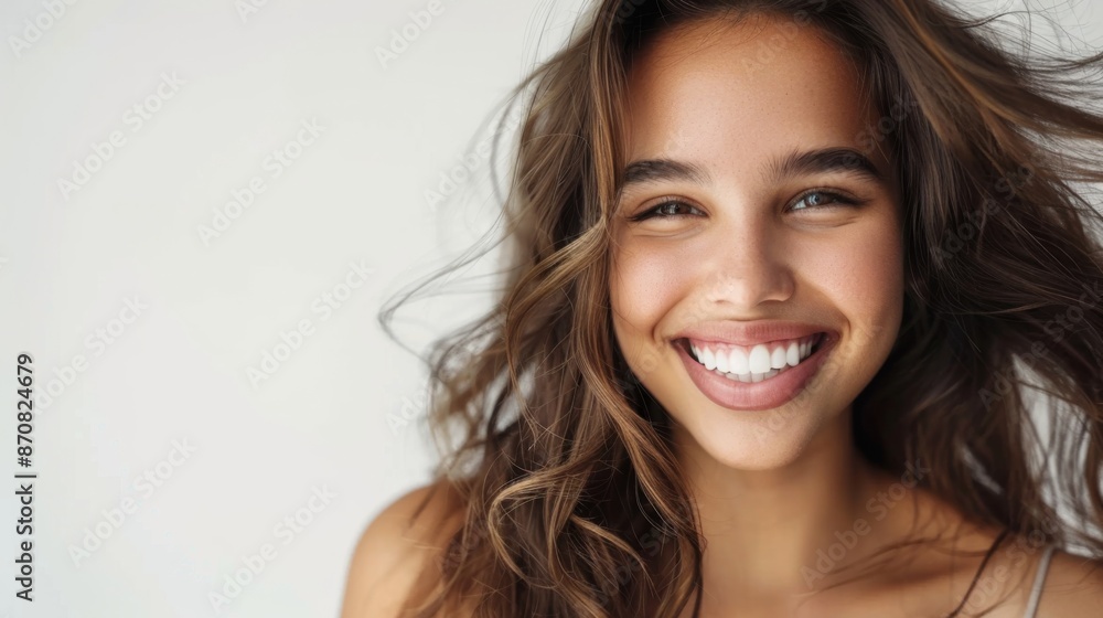 Portrait of a beautiful young latin model woman smiling on a white background Portrait of a beautiful young latin model woman smiling on a white background