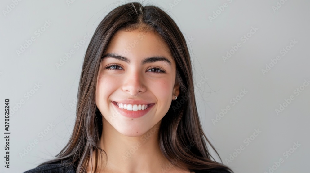 Portrait of a beautiful young latin model woman smiling on a white background Portrait of a beautiful young latin model woman smiling on a white background