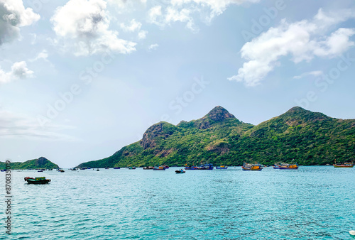 Beautiful Landscape With Coastal Mountain And Fishing Boats On The Sea Of Con Dao Island, Vietnam. Con Dao Island Is An Ideal Off The Beaten Path Beach Destination In The South Of Vietnam.