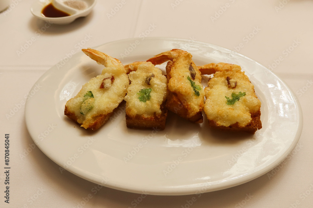 close up of Hong Kong Cantonese style deep fried prawn shrimp toast close up of Hong Kong Cantonese style deep fried prawn shrimp toast