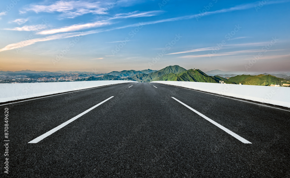 Fototapeta premium Empty asphalt road and mountains background
