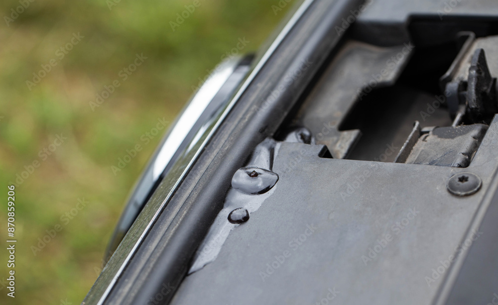 A leak of technical fluid in the engine compartment of the car. Car malfunction concept. Leakage, copy space for text A leak of technical fluid in the engine compartment of the car. Car malfunction concept. Leakage, copy space for text
