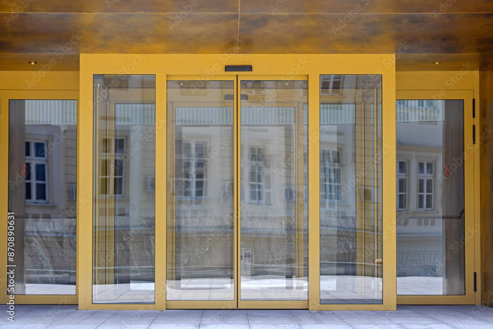 Automatic Sliding Doors Golden Entrance to Modern Office Building