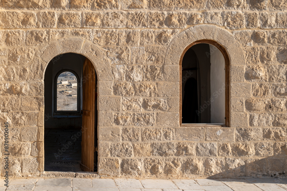 Beautiful Stone Walls, Arched Door and Window of the Scholar Rooms of An Nabi Musa Mosque with Cemetery in the Background