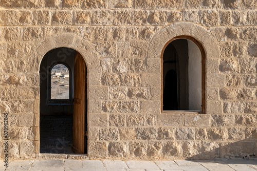 Beautiful Stone Walls, Arched Door and Window of the Scholar Rooms of An Nabi Musa Mosque with Cemetery in the Background