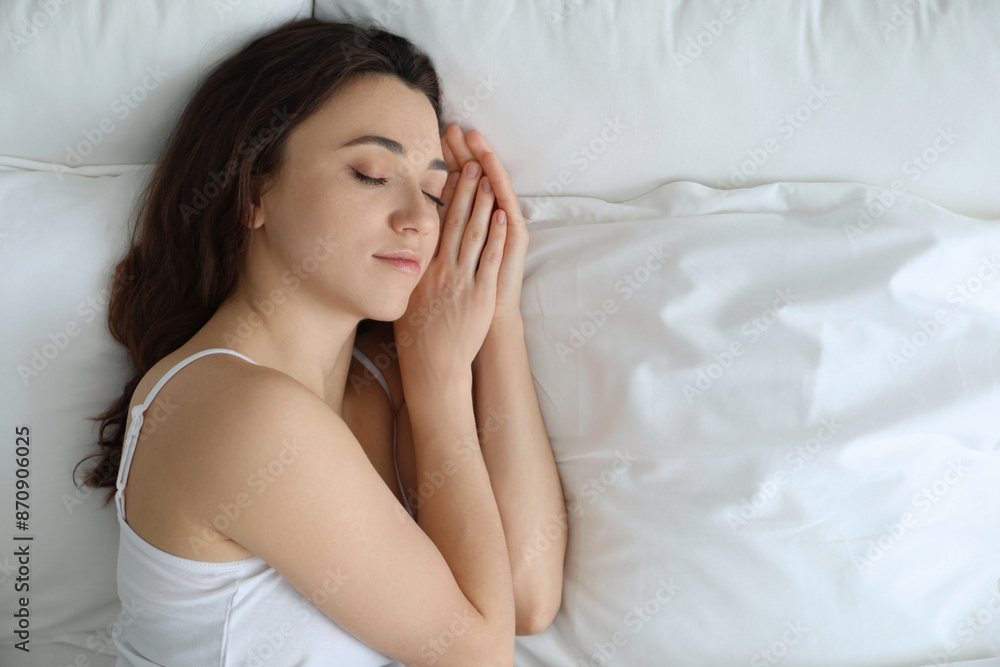 Bedtime. Beautiful woman sleeping on bed in morning, top view. Space for text Bedtime. Beautiful woman sleeping on bed in morning, top view. Space for text