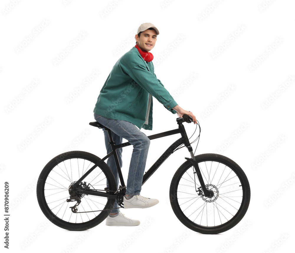 Naklejka premium Man with headphones riding bicycle on white background
