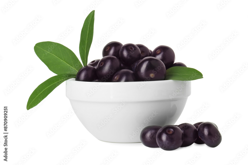 Fresh ripe acai berries in bowl and green leaves isolated on white Fresh ripe acai berries in bowl and green leaves isolated on white