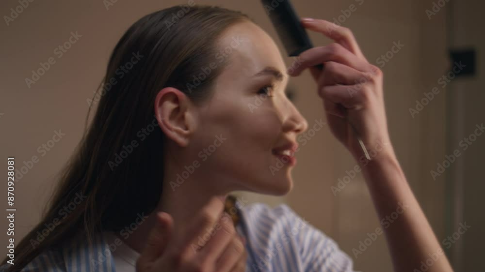Fashion girl styling hair preparing for date closeup. Attractive lady combing Fashion girl styling hair preparing for date closeup. Attractive lady combing